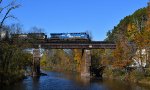 NS's CR heritage unit leads 11J's autoracks east over the Raritan River